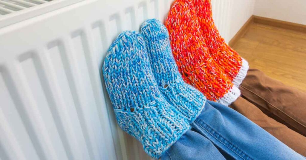 Warm socks by a heater