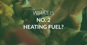 A background image of someone fixing an oil tank with the text "What is No. 2 heating fuel?"