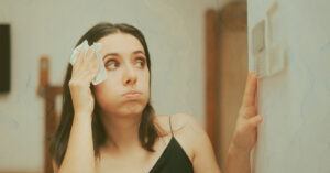 woman turning on the ac